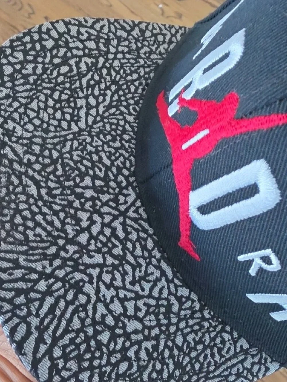 Jordan Kids Black Snapback with Red Jumpman and Grey Elephant Print Brim